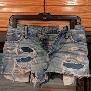 Destressed blue jean shorts